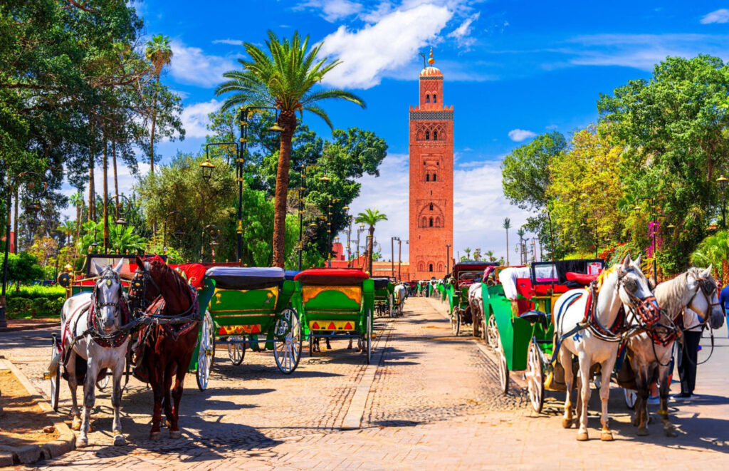 Marrakesh Morocco Beautiful view of the horse carriage in front of the Koutoubia Mosque minaret at Medina quarter from Jemaa el-Fnaa North Africa marrakech