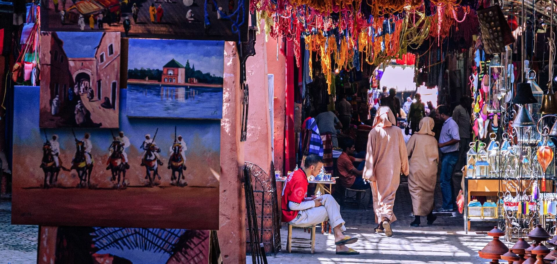 Private tour guide in Morocco leading tourists through the Marrakech medina