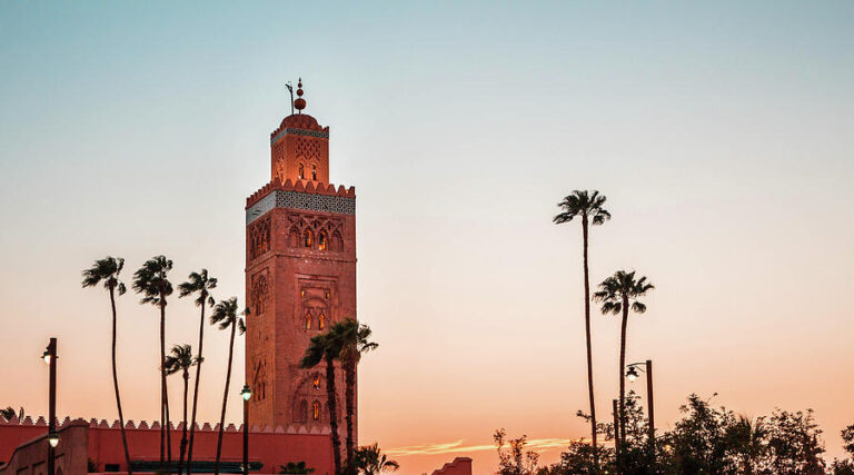 Panoramic view of the iconic Koutoubia Mosque at sunset with Marrakech Luxury Marrakech Tour